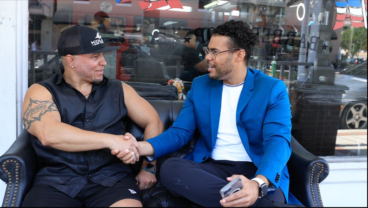 Founder of NotifyGrid and Tony Rivera of Tony Touch Barbershop shaking hands in Kissimmee, FL